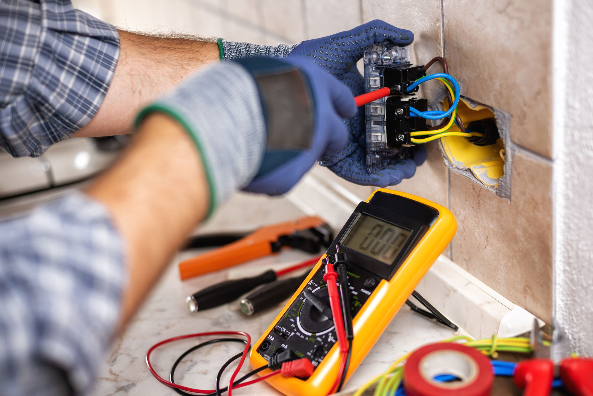 Electrician completing a residential electrical repair
